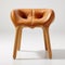 Curved Leather Stool On Wooden Base - Bold Gestures And Intuitive Design