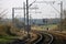 Curved local railway line with overhead cables