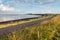 Curved road along the water of an estuary