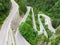 Curved road with cars and beautiful forest landscape.