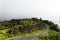 Curved road to Doi Inthanon National Park, Chiangmai, Thailand in misty