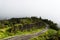 Curved road to Doi Inthanon National Park, Chiangmai, Thailand in misty