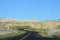 Curved Roads of Badlands National Park on a Clear Day