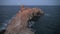 Curved rock ocean and moon in sky