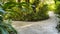 A curved rock walking trail through a tropical botanical garden