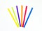 Curved row of colorful plastic straws fanned out