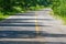 Curved rural paved road in the summer