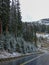 a curved street in the winter in the rocky mountains