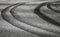 Curved tires tracks on dark asphalt road