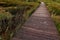 Curved wooden plank raised pathway above salty marsh in Nin, Croatia