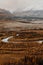 The curves of the ribbon of the river in a mountain valley.