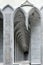 Curvilinear arch niche sitting places in black and white. Digitally reworked close-up photo of architectural fragment