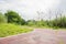 Curving greenway,red-painted foot path,in cloudy summer