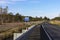 Curving highway with koala and wildlife fencing.