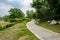 Curving lakeside path in cloudy summer afternoon