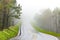 Curving Mountain Road In Fog With Copy Space