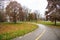 Curving Path in a Riverside Park and Cloudy Sky