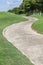 Curving pathway green golf course and beautiful nature scene.