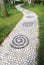 The curving pebble pavement footpath