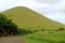 Curving road to the greeny hill on Easter Island, Chile, South America