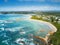 The curving sands of Tomakin beach and coast aerial views Australia