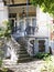 A curving staircase at the facade of the house