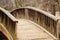 Curving Wood Bridge Over Stream