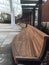 Curving wooden benches under covered university mall