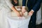 Curvy bride in white lace dress and a groom. Wedding couple at the ceremony. Man and wife giving marriage vows. Engagement rings.