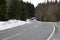 curvy country road across the Hohe Acht with snow