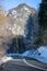 Curvy country road in the mountains, winter landscape