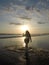 Curvy female in the sunset on the beach