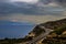 Curvy highway at the edge of a cliff with ocean below