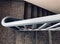 Curvy metallic barrier of a stair cases inside a house