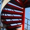 Curvy red metallic stairs isolated unique photo