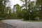 curvy road through Nettetal in late summer, inside the curve a hut gone a few month later