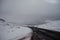 A curvy road through snow in Iceland