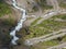 Curvy serpentine road by river in Norway