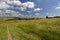 A curvy and sloping green grassland