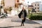 Curvy stunning smiling woman walking on cozy Italian street