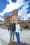 Cusco County, Peru - August 7th, 2018: A young asian couple stand in front of a church on the famous Main Square of Cusco, Peru. T