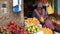CUSCO, PERU- JUNE 20, 2016: a woman bags fresh mandarins at a market in cuzco