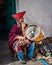 CUSCO, PERU - OCTOBER 1, 2016: native Peruvian playing national musical instrument Zampona Marimacha, dressed in colorful tradit