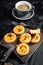 Custard Tarts Pasteis de Belem, Portuguese pastel de Nata. Black background. Top view