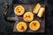 Custard Tarts Pasteis de Belem, Portuguese pastel de Nata. Black background. Top view