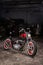 Custom bobber motorbike in an workshop garage.