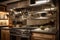 custom-built cooking station featuring glass cooktop, stainless steel hood and hanging pots and pans