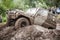 Custom built Off-road Trophy UAZ 469 passing mud pit.