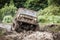 Custom built Off-road Trophy UAZ 469 passing mud pit.