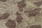 Custom camouflage texture pattern, horizontal pale green tan taupe brown textured camo background, old aged weathered cotton twill